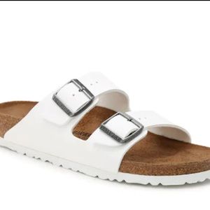 Women Birkenstock Arizona white sandals.
